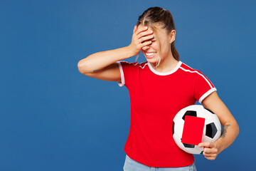 Young woman fan in t-shirt cheer up support football sport team do facepalm gesture hold soccer...