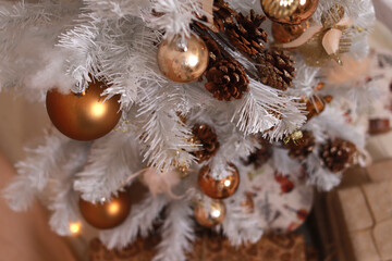 Christmas tree with white branches, decorated with beautiful balls. Christmas. Close-up. Copyspace
