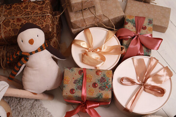 New Year's gifts. Toys, boxes. In beige tones. Christmas. Close-up. Copyspace