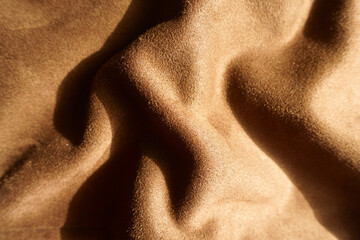 Draped chocolate brown faux suede polyester fabric