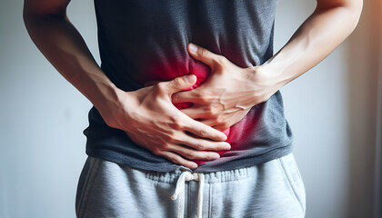 A young man suffering from upper abdominal pain.