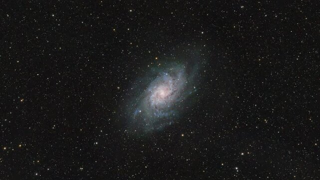 Cosmic Travel. An Interstellar Journey through the Depths of Space. Animation of a real astronomical photograph of the Triangulum Galaxy M33 captured by me. High quality 4k footage