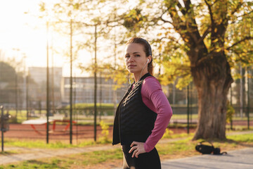 Fit Caucasian woman working out outdoors.