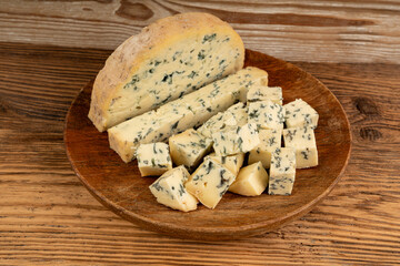 Fourme cheese, stinky french cheese, Fourme d'Ambert gourmet food, semi-hard blue cheese