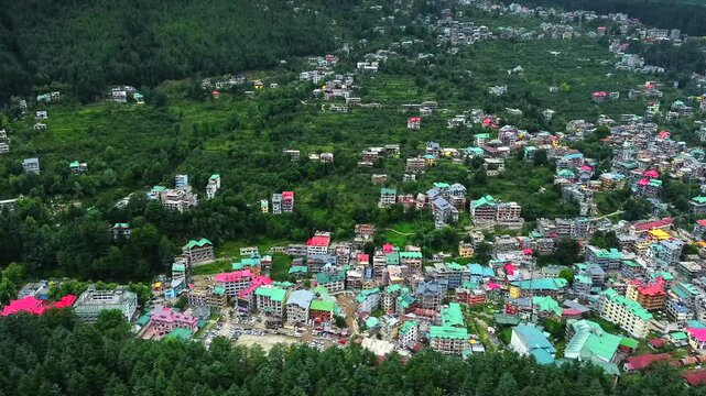 Aerial view of manali with the beas river in himachal pradesh India. Himalayan mountains and colourful local houses nestled in the hills of manali himachal pradesh India.