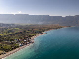 Obraz premium Aerial drone view of the coastline and beach in Orikum, Albania.