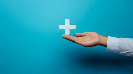 A male hand holding a plus icon against a blue background, symbolizing positive offerings like personal development, social networking, and health benefits.