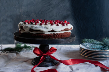 Delicious ready to eat wreath Christmas cake decorated with fresh cranberries and cream cheese frosting with festive styling