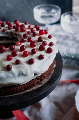 Delicious ready to eat wreath Christmas cake decorated with fresh cranberries and cream cheese frosting with festive styling