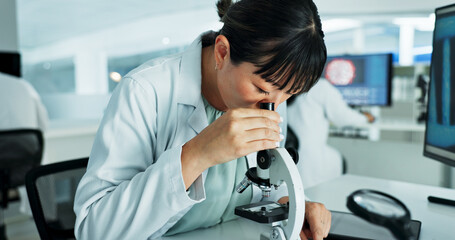 Woman, microscope and science with dna in lab for medical research, review and check with...