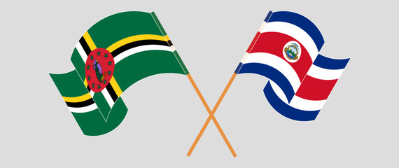 Crossed and waving flags of Dominica and Costa Rica. Vector illustration