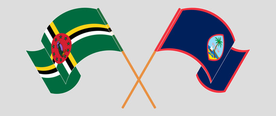 Crossed and waving flags of Dominica and Guam. Vector illustration