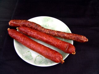 Sausage on a plate close view background