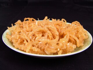 Seafood dishes on white plates