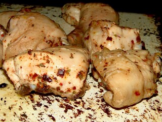 Slices of cooked meat on a plate background