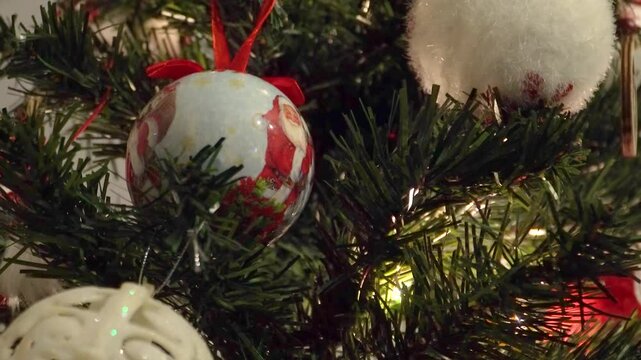 Christmas Balls on Tree and Lights Blinking Background, Closeup Shot