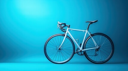 A contemporary road bike with sleek lines stands out against a vivid blue backdrop.