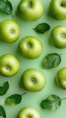 Fototapeta premium Fresh green apples arranged on a solid light background showcasing their vibrant colors