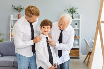 Obraz premium Father, son, and grandfather dress up together and look in the mirror at home on Father Day. They celebrate as a family, sharing this special moment with dad, bonding and enjoying the day together.