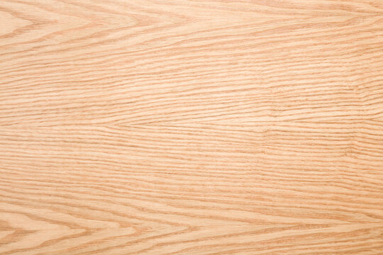 Light ash veneer wooden surface background. Closeup. Empty place for text. Top down view.