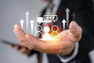 Businessman holding virtual target customer icon for customer focus group and Targeting customer...