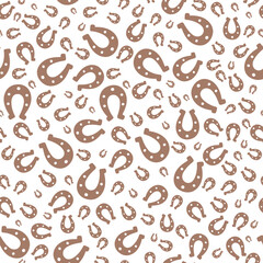 Brown silhouette of lucky horseshoe. Seamless vector pattern. Endless ornament. Isolated colorless background. Chocolate horse shoes. St. Patricks Day. Flat style. Repeating symbol of happiness.