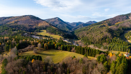 Top cinematic Aerial view of serene and majestic alpine landscape with mountains, valleys, and lush forests. Austrian wild nature and landscape from above. 