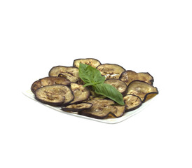 Sliced eggplants with basil on white plate, isolated on transparent background