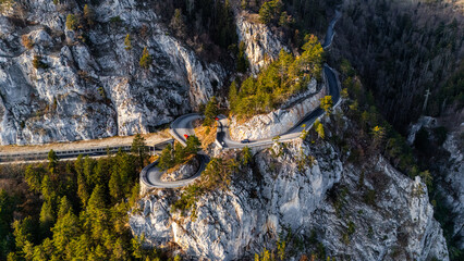 Cinematic Aerial View of the Austrian Alps: Car on a Serpentine with Breathtaking Scenery, drone footage