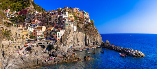 Italy, Cinque terre famous national park of traditional fishing villages. Manarola colorful houses and picturesque bay. popular tourist attraction in Liguria