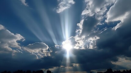Sunbeams pierce through dark storm clouds illuminating the sky