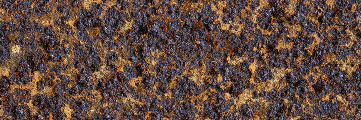 Texture of rusty metal. Rough metal surface with rust. Corroded and oxidized old iron. Rusted and aged metal sheet. Wide panoramic texture for background and design in grunge style.