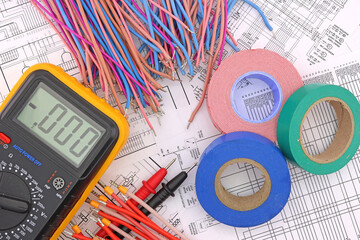 A roll of colored insulating tape. On a dark background.