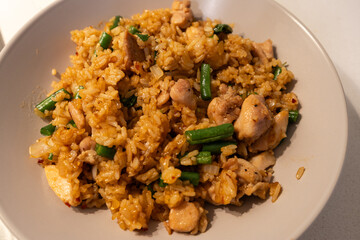A plate of chicken fried rice.