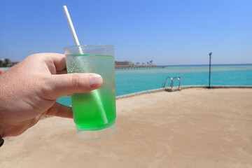 drink in the plastic pot on the beach