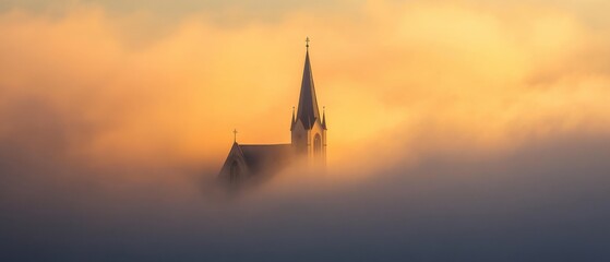 mystical church tower emerging from fog at sunrise