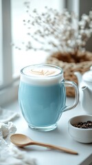 Blue Matcha Latte with Vibrant Foam and Powder in Cozy Setting