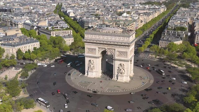 PARIS, FRANCE - OCTOBER 3, 2024: Aerial view of the Arc de Triomphe and bustling traffic at the famous roundabout