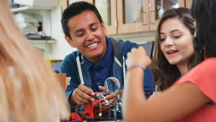 High School College Or University Students Building Robotic Vehicle In Science Lesson