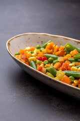Mexican Mix of Vegetables. Tomatoes, Green Beans, Peas, Corn. Dietary Food.Bright vegetable mix .Vegetarian food.Assorted.