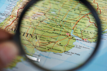 view of Buenos Aires, Argentina on a geographic map of the Americas, seen using a magnifying glass