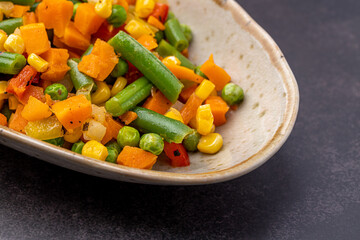 Mexican Mix of Vegetables. Tomatoes, Green Beans, Peas, Corn. Dietary Food.Bright vegetable mix .Vegetarian food.Assorted.