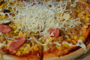 Pizza with sausages and cheese