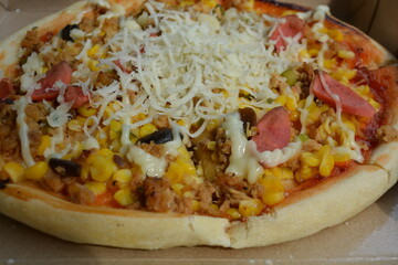 Pizza with sausages and cheese