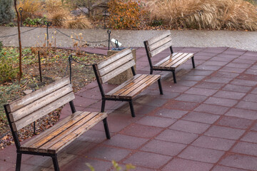 Empty park benches in a row