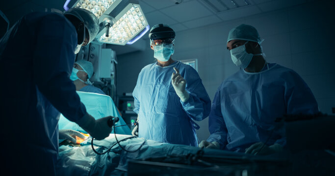 Female Surgeon is Equipped with an Augmented Reality Headset, Relies on Virtual Overlays to Make Quick, Informed Decisions as Nurses and Assistants Offer Steady Support During the Surgical Procedure - Powered by Adobe