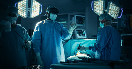 Portrait of a Black Male Surgeon Using an AR Headset, Analyzing Vital Patient Data Only Visible in Extended Reality Glasses, His Team Helps with the Medical Operation in a Hospital