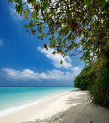 Paradise island beach landscape in sunny day, tropical dream scenery for resort vacation and holidays. Summer tranquility and calm amazing scenery with bright blue sky, turquoise water of lagoon