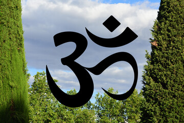 Om symbol on trees and sky background. Symbol of Buddhism and Hinduism religions.