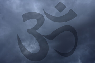 Om symbol transparent on sky background. Symbol of Buddhism and Hinduism religions.